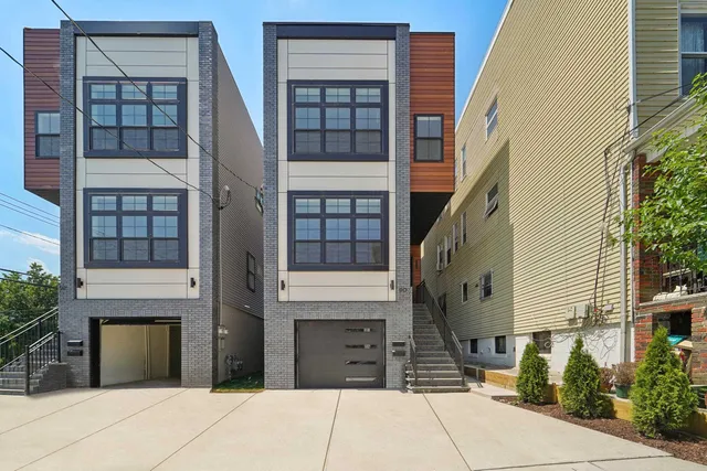 a front view of a house with a garage