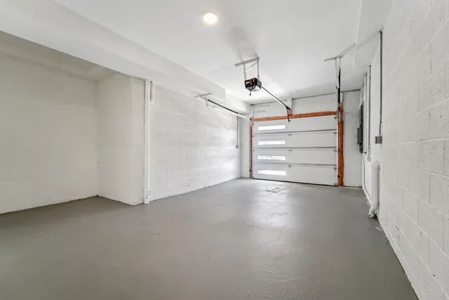 an empty room with a empty space and a ceiling fan