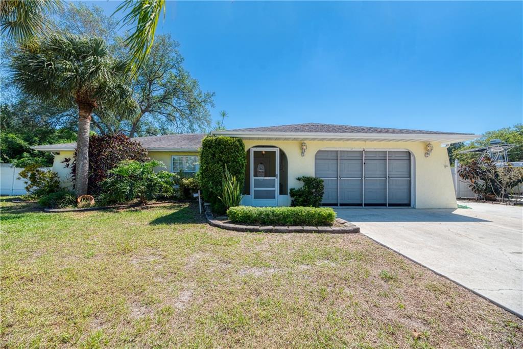 215 Columbia Road Venice, FL 34293 - Photo 1 of 1 a front view of a house with garden