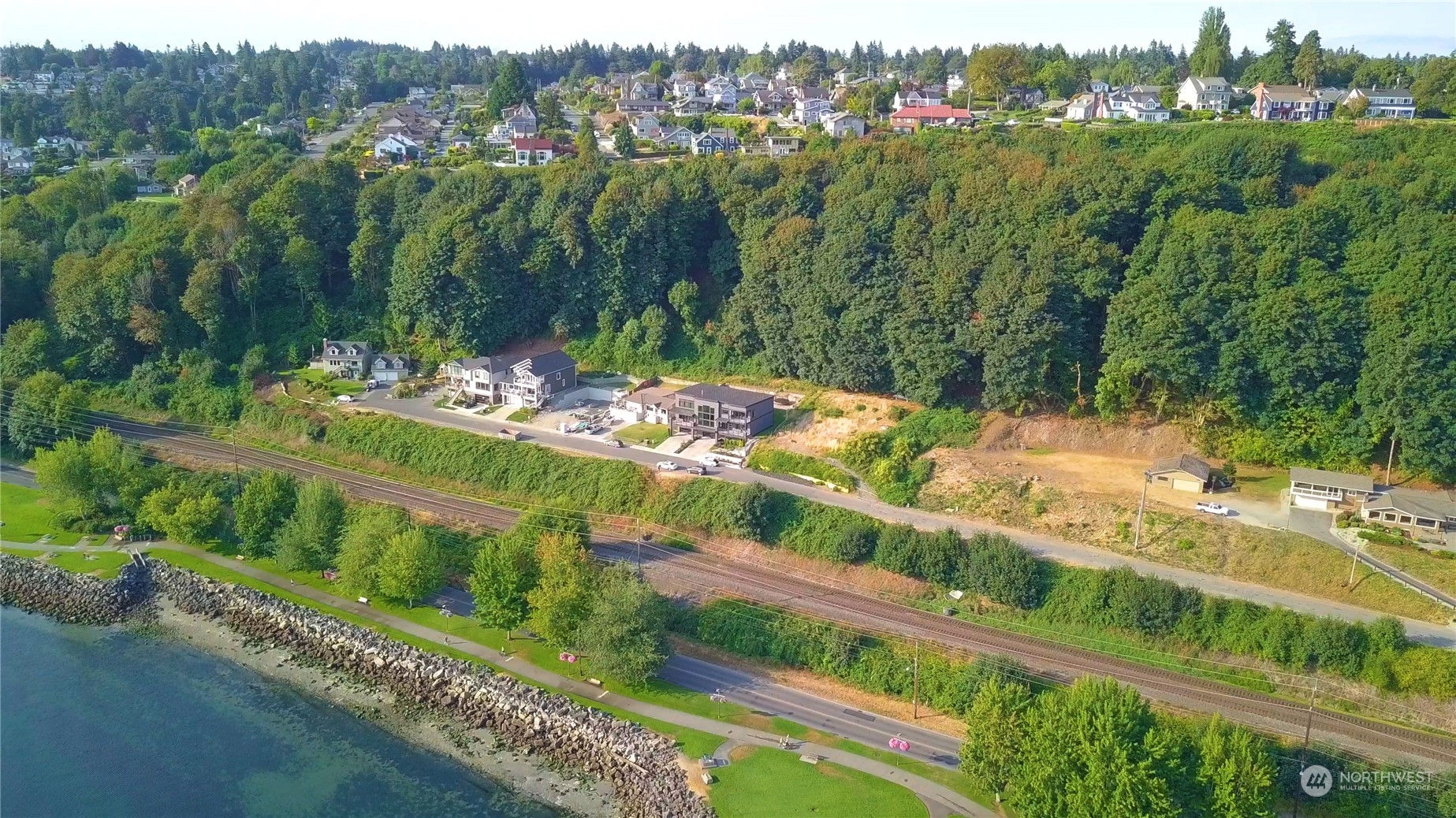 3901 North Adams Street Tacoma, WA 98407 - Photo 10 of 11 a view of a garden with a lot of trees and cars