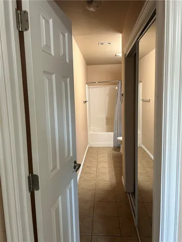 a bathroom with a tub and shower