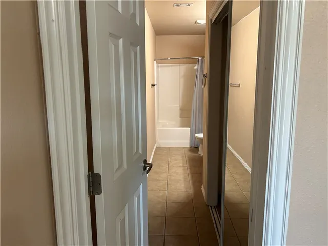a bathroom with a glass door shower