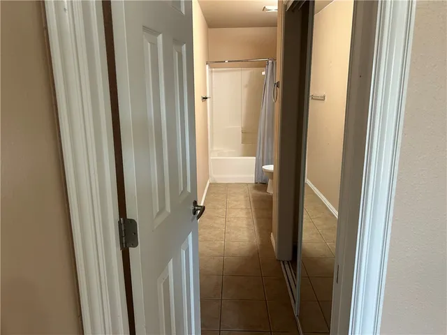 a bathroom with a glass door shower
