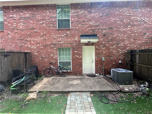 a backyard of a house with yard barbeque oven and outdoor seating