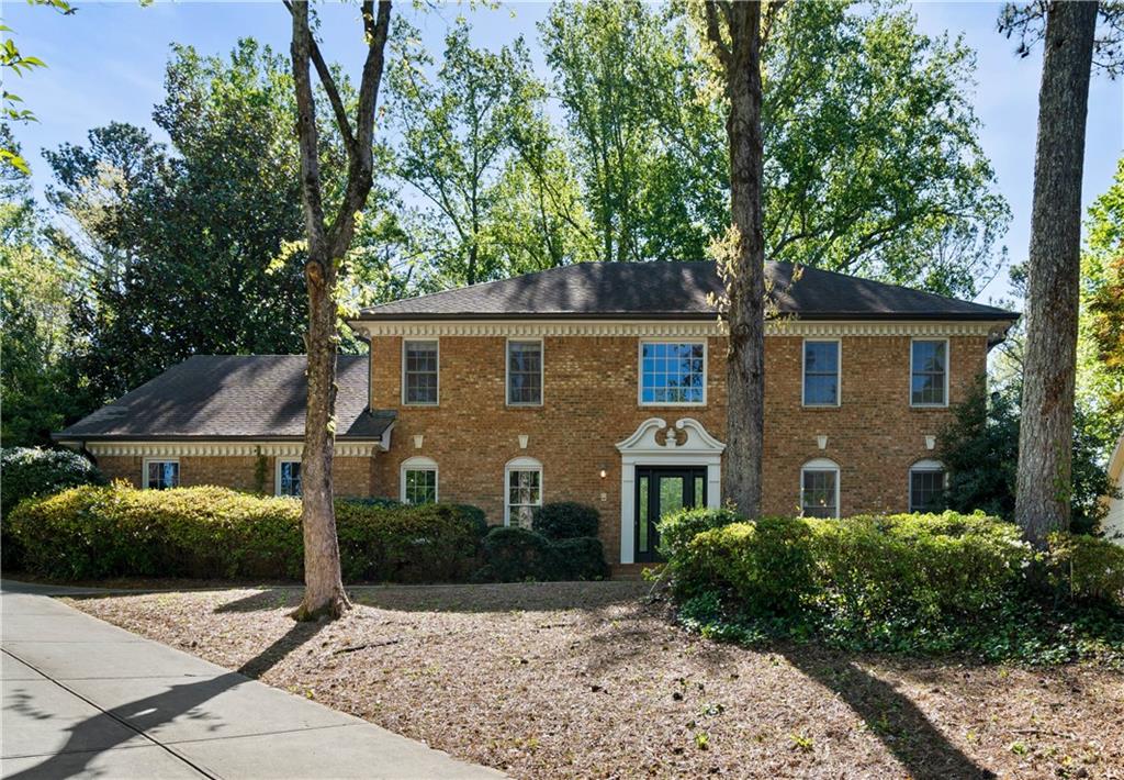 This classic brick 3-story home is located on a private lot in the Breakwater subdivision of Sandy Springs complete with a finished basement.