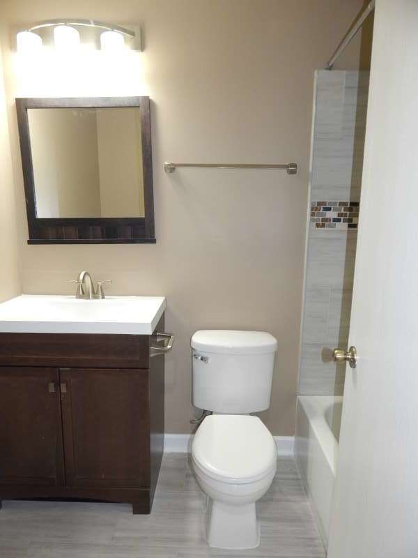 1216 Calico Avenue Naperville, IL 60564 - Photo 13 of 16 a bathroom with a sink toilet and mirror