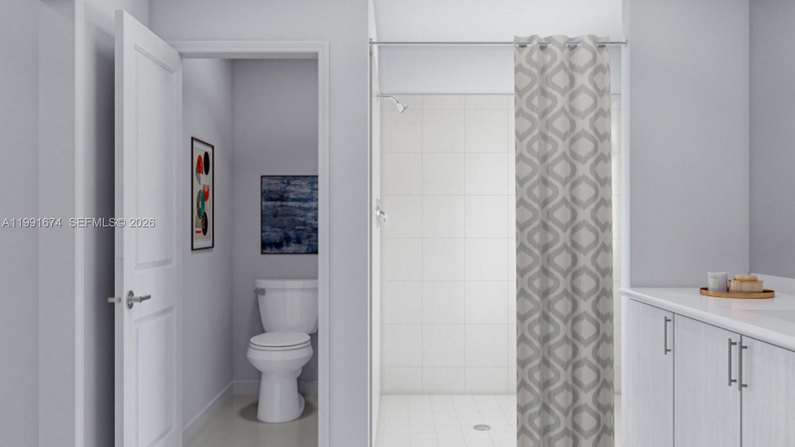 19435 Southwest 337th Terrace Homestead, FL 33034 - Photo 8 of 13 a bathroom with a toilet and a shower curtain