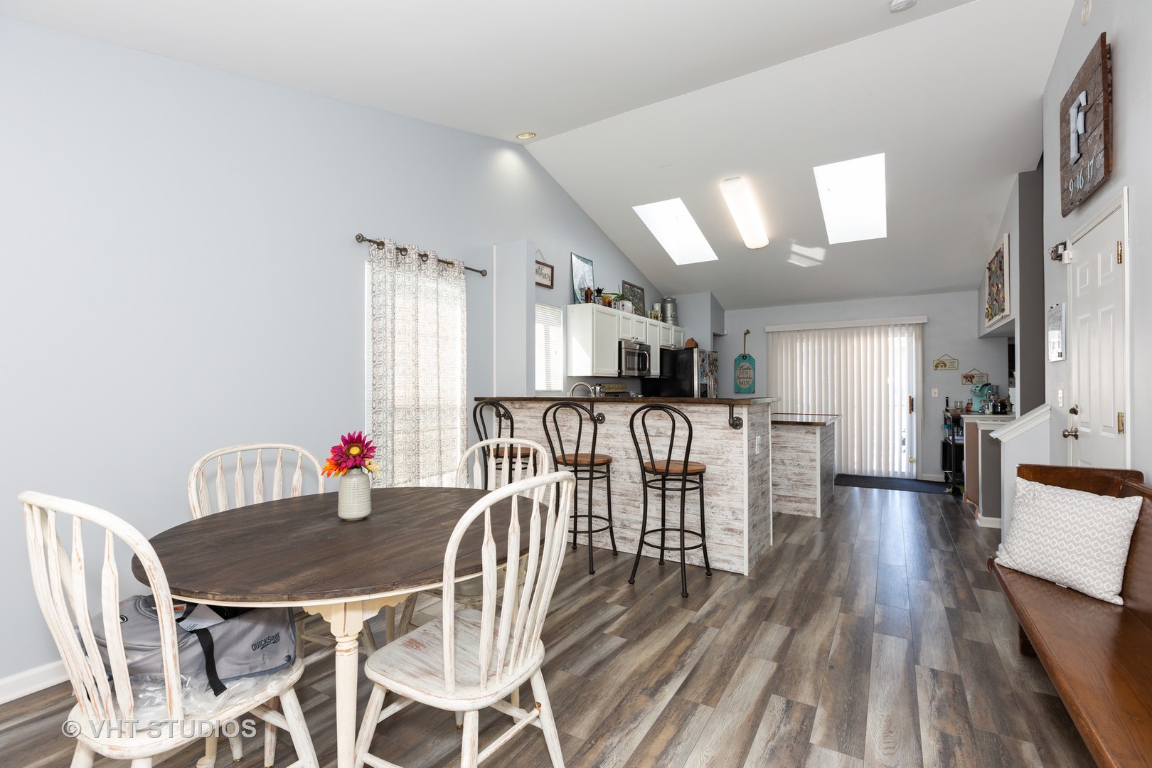 1003 Greenleaf Drive Joliet, IL 60436 - Photo 2 of 10 a view of a dining room with furniture and wooden floor