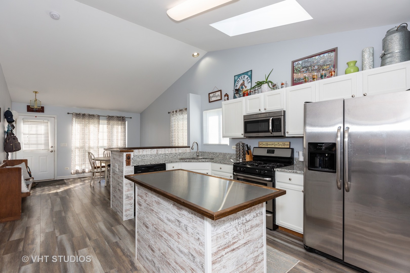 1003 Greenleaf Drive Joliet, IL 60436 - Photo 3 of 10 a kitchen with kitchen island a sink stove and refrigerator