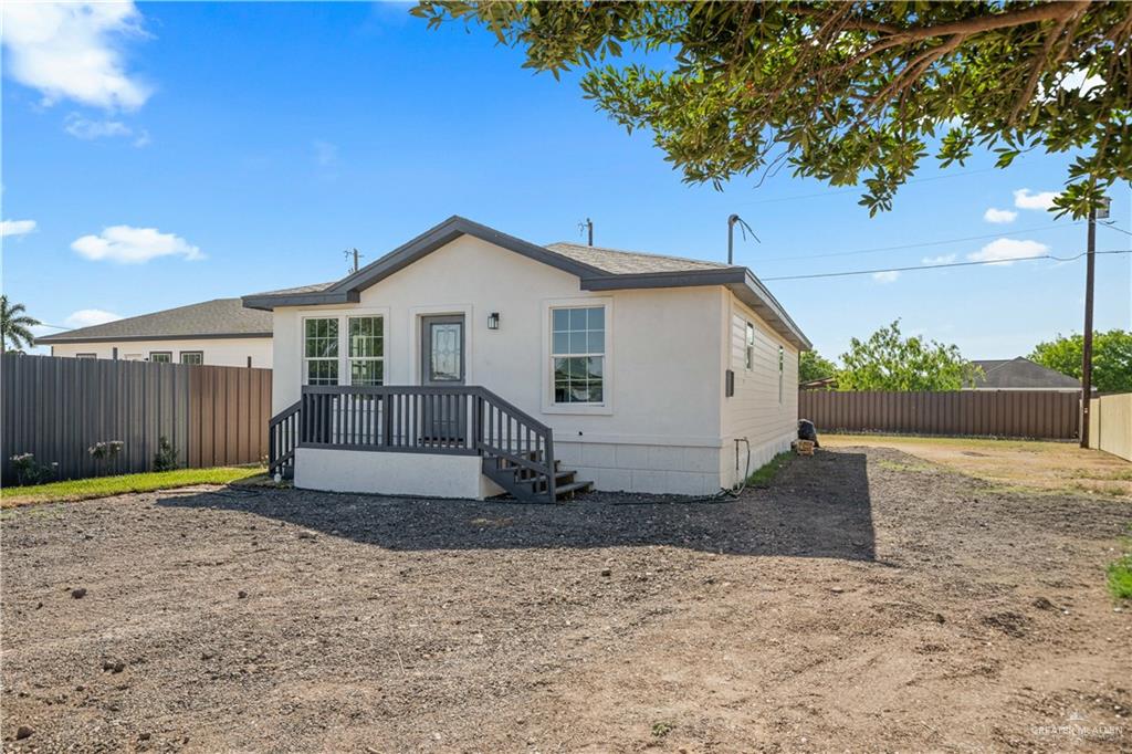 1343 Middle Street Alamo, TX 78516 - Photo 2 of 17 a view of a house with a yard and fence