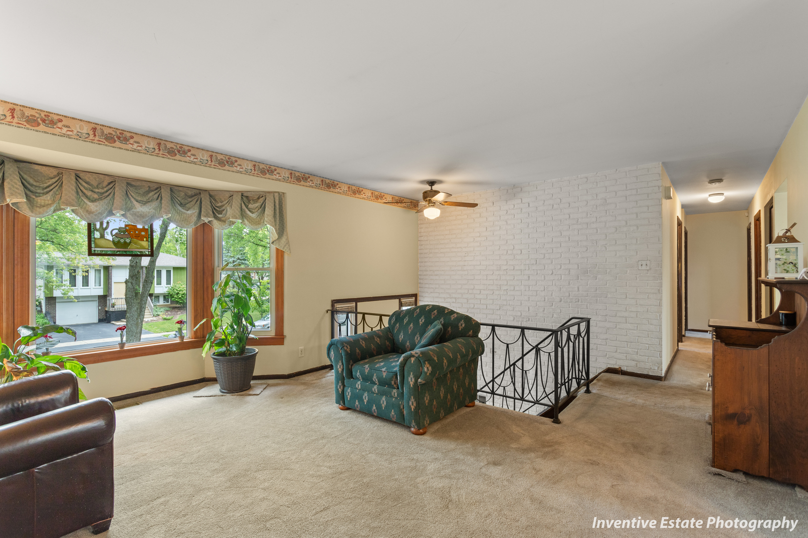 359 Galahad Road Bolingbrook, IL 60440 - Photo 5 of 22 a living room with furniture and a floor to ceiling window