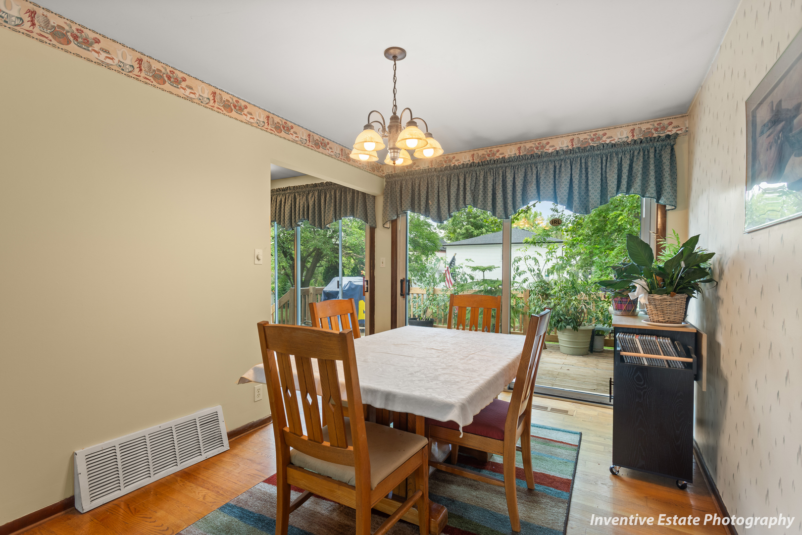 359 Galahad Road Bolingbrook, IL 60440 - Photo 7 of 22 a view of a dining room with furniture window and wooden floor