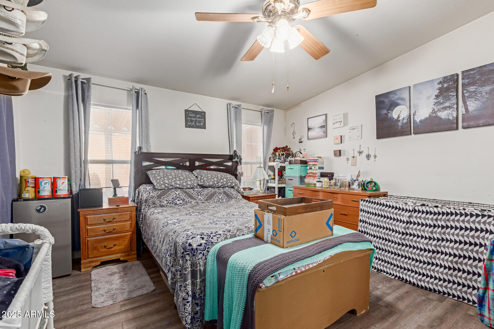 1347 South Oak Road Maricopa, AZ 85139 - Photo 12 of 30 a bedroom with a bed and wooden floor