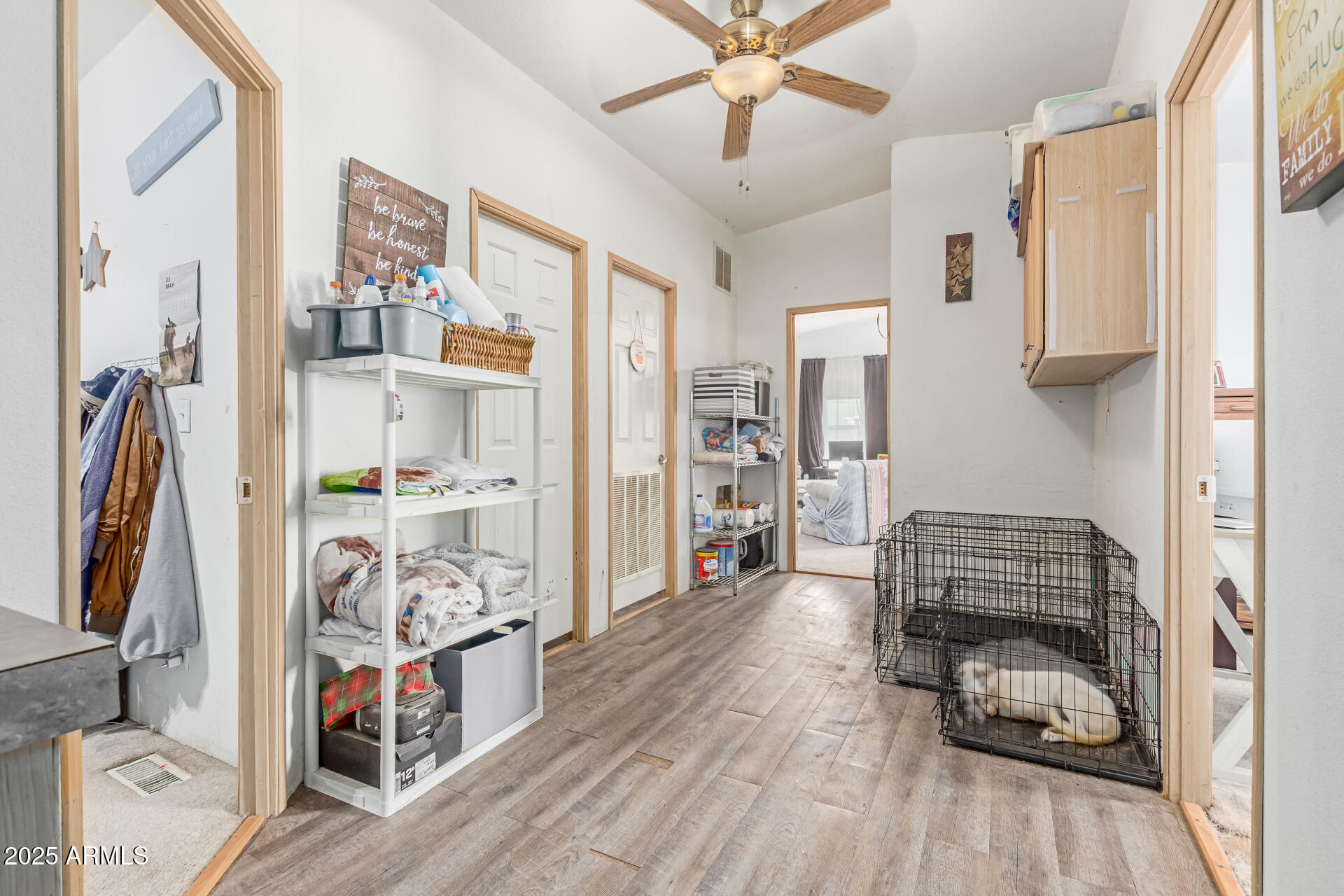 1347 South Oak Road Maricopa, AZ 85139 - Photo 18 of 30 a bedroom with furniture and a book shelf