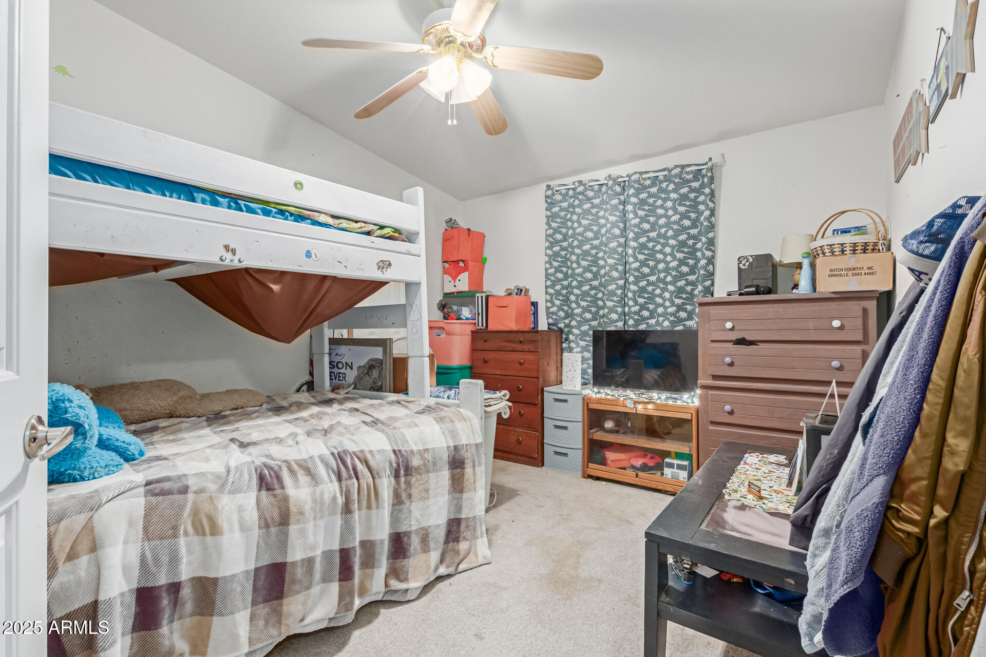 1347 South Oak Road Maricopa, AZ 85139 - Photo 19 of 30 a bedroom with a bed a flat screen tv and fireplace