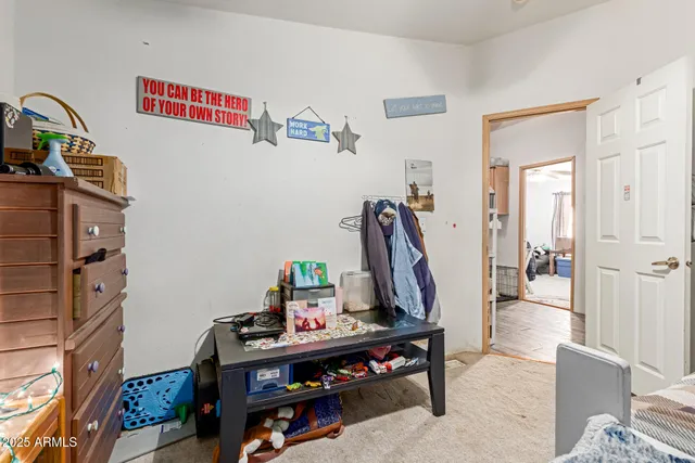 a view of a hallway with workspace and toys