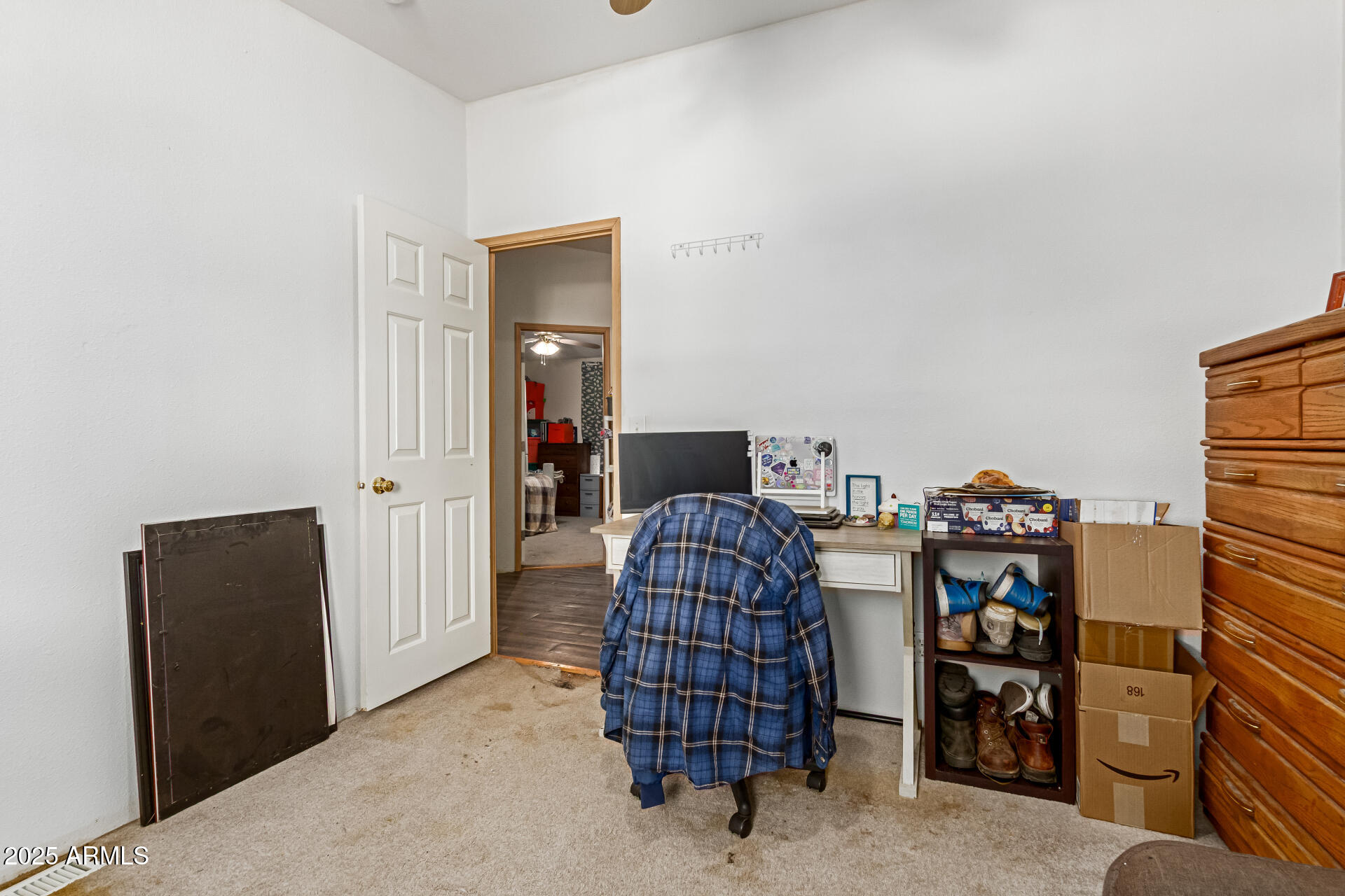 1347 South Oak Road Maricopa, AZ 85139 - Photo 21 of 30 a bedroom with a bed and a television