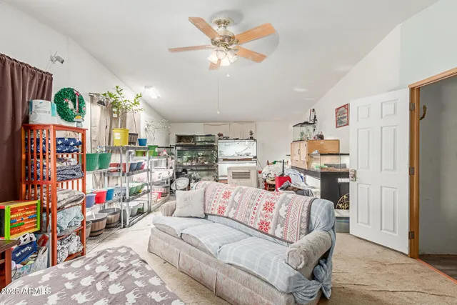 a living room with lots of furniture and a flat screen tv