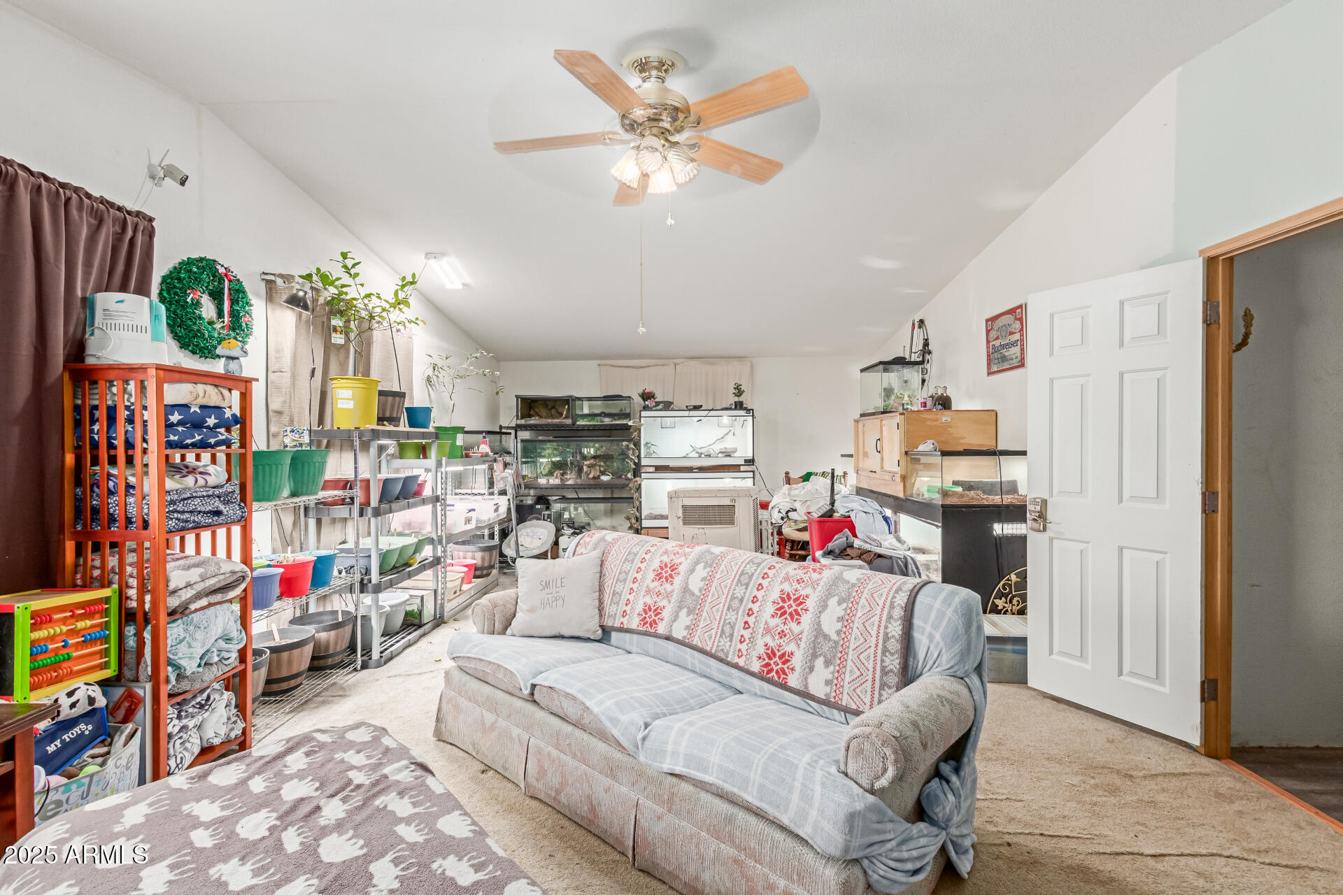 1347 South Oak Road Maricopa, AZ 85139 - Photo 22 of 30 a living room with lots of furniture and a flat screen tv