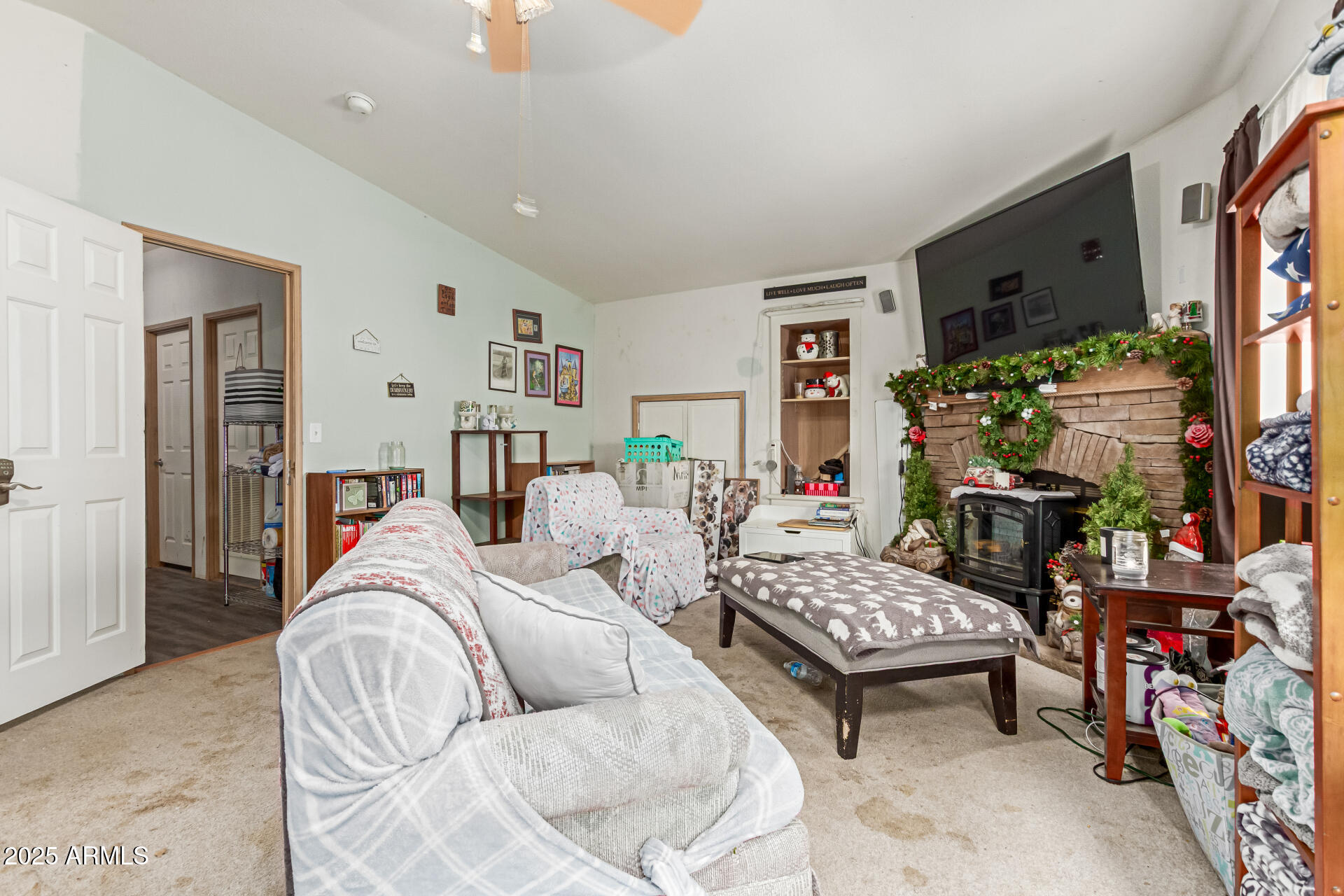 1347 South Oak Road Maricopa, AZ 85139 - Photo 23 of 30 a living room with furniture and a flat screen tv
