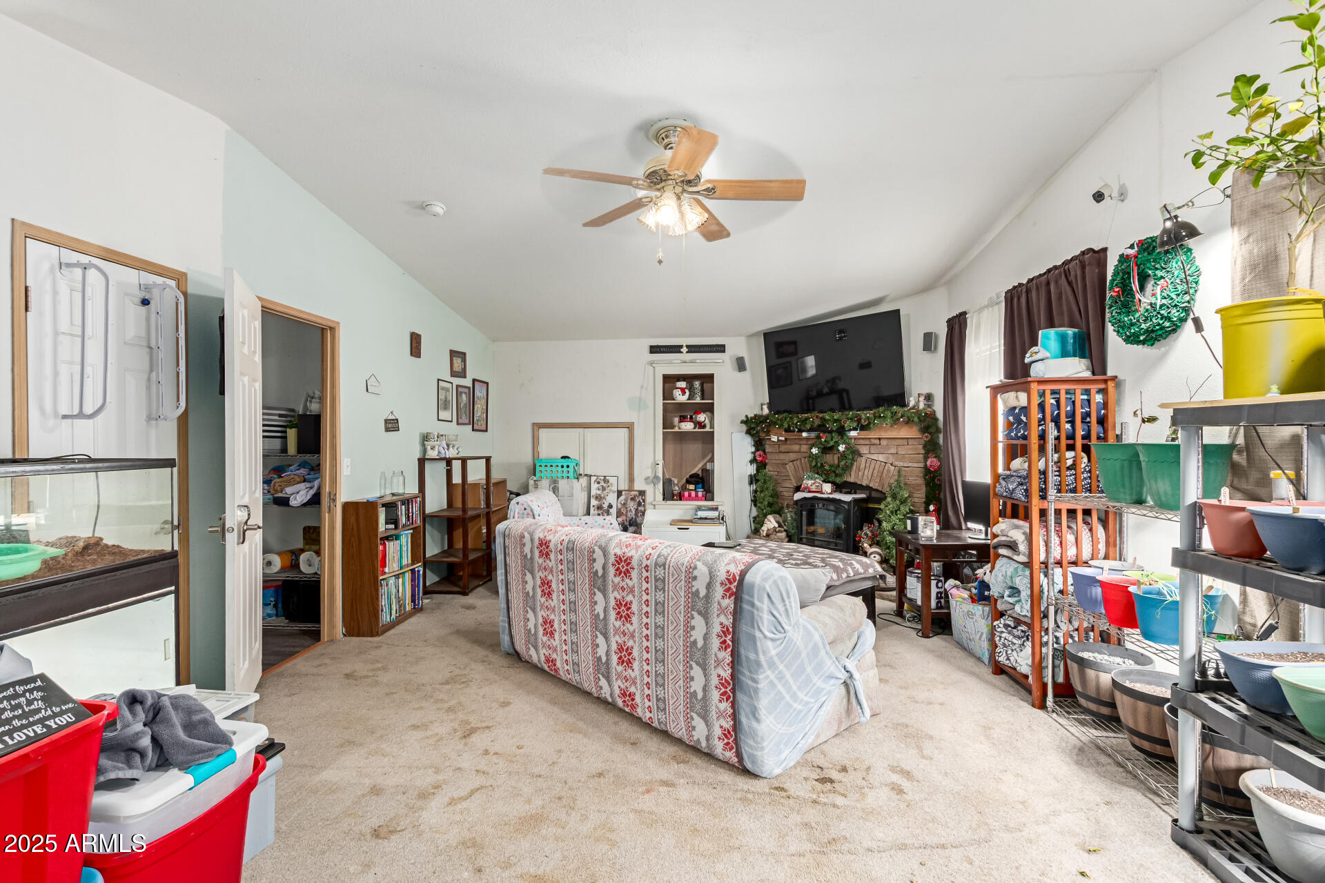 1347 South Oak Road Maricopa, AZ 85139 - Photo 24 of 30 a living room with lots of furniture and a flat screen tv