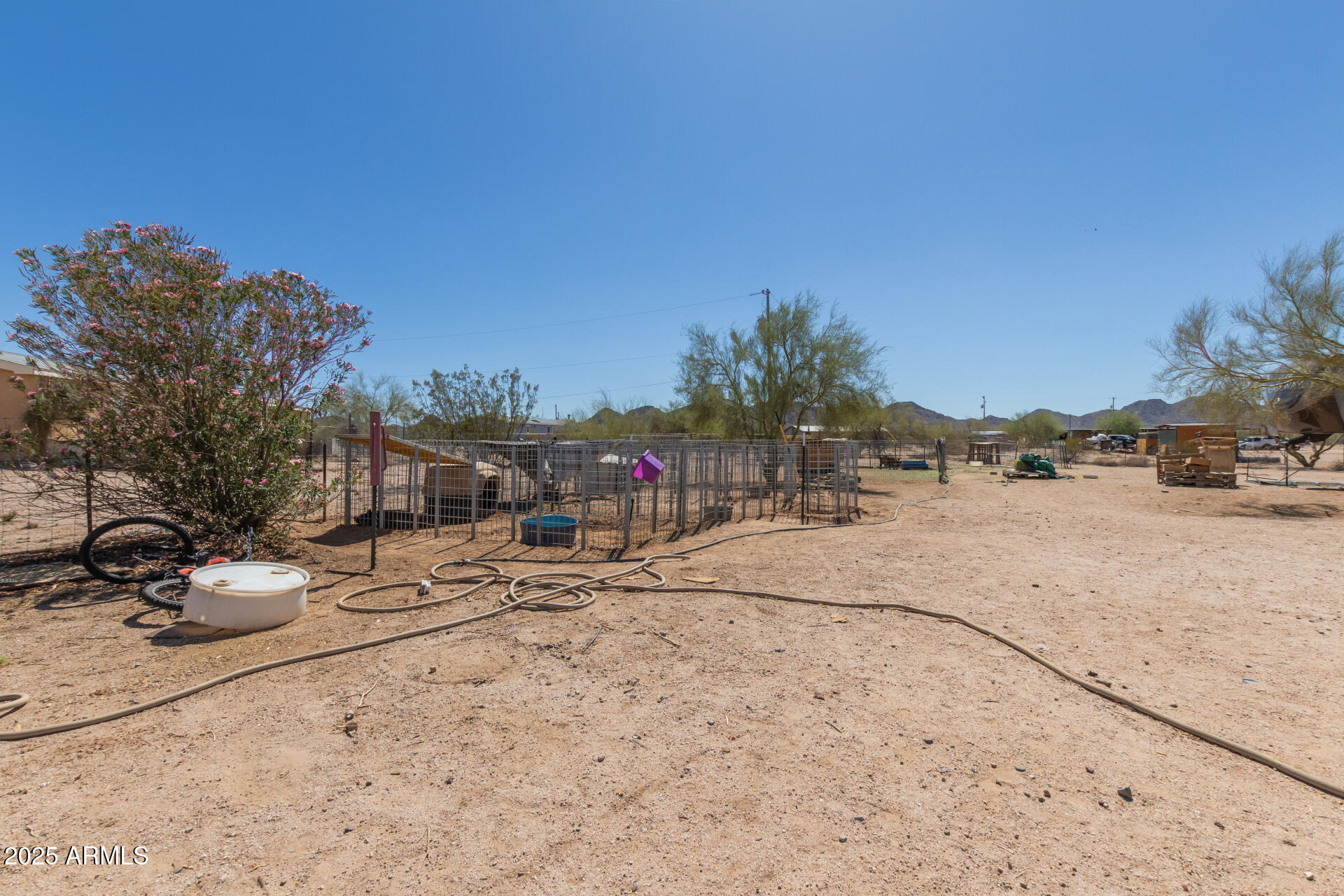 1347 South Oak Road Maricopa, AZ 85139 - Photo 25 of 30 a view of a road with a building in the background