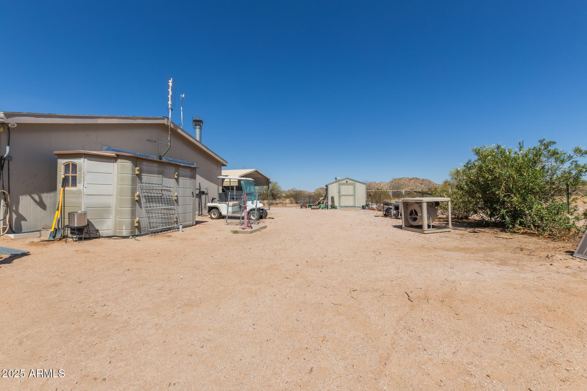 1347 South Oak Road Maricopa, AZ 85139 - Photo 27 of 30 a front view of a house with a yard and garage