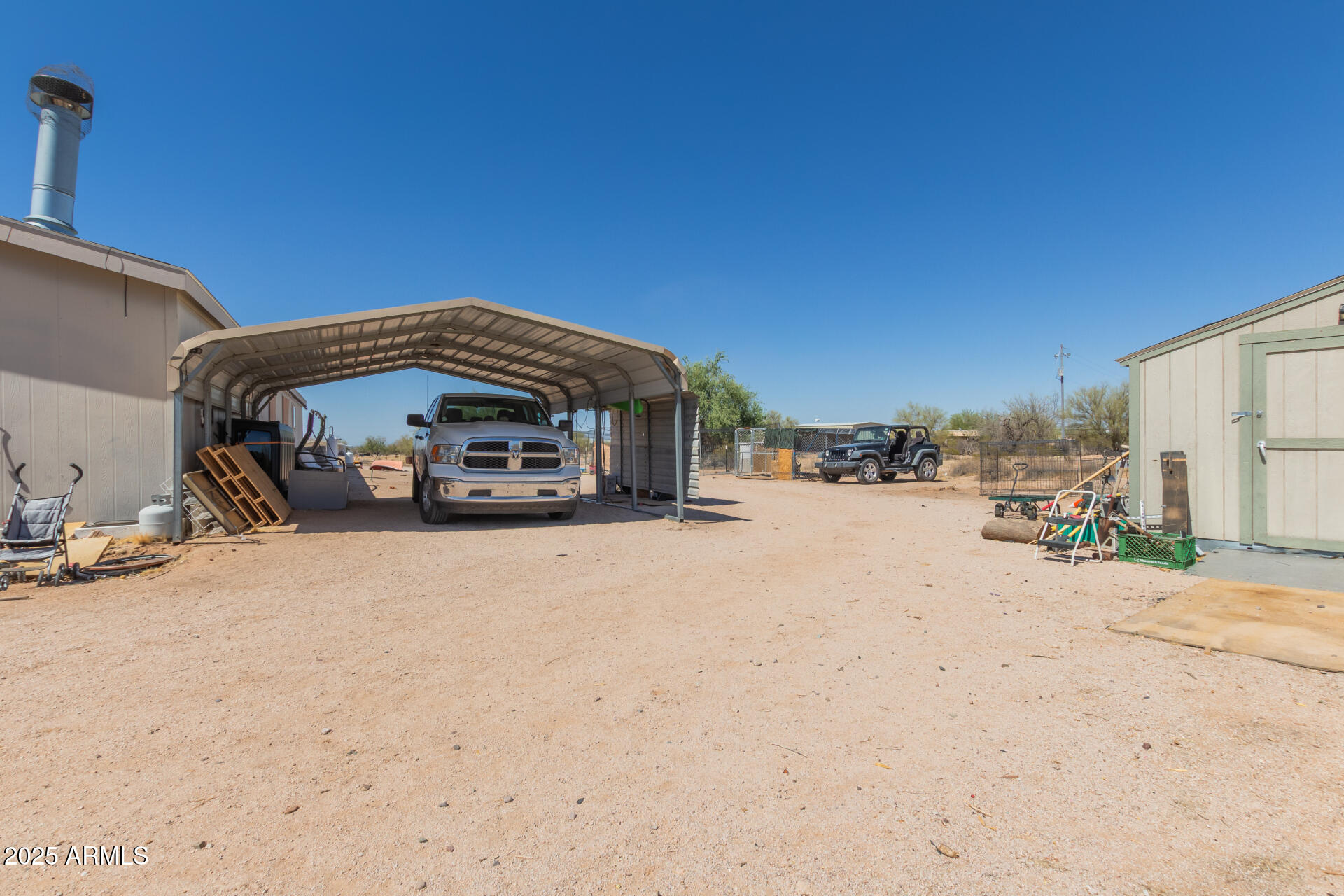 1347 South Oak Road Maricopa, AZ 85139 - Photo 28 of 30 a view of a house with a outdoor space