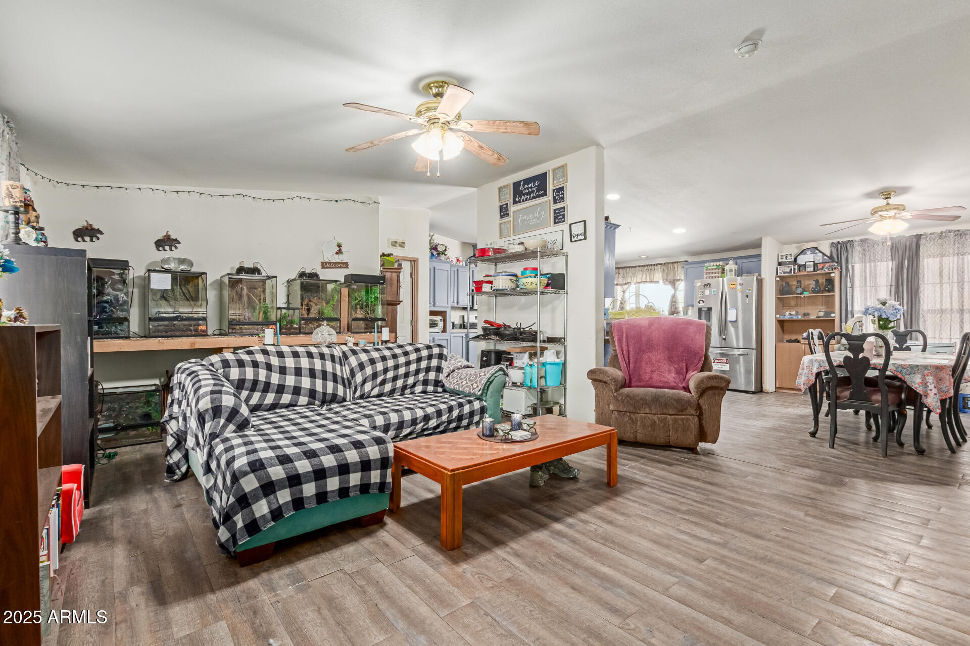 1347 South Oak Road Maricopa, AZ 85139 - Photo 6 of 30 a bedroom with furniture and wooden floor
