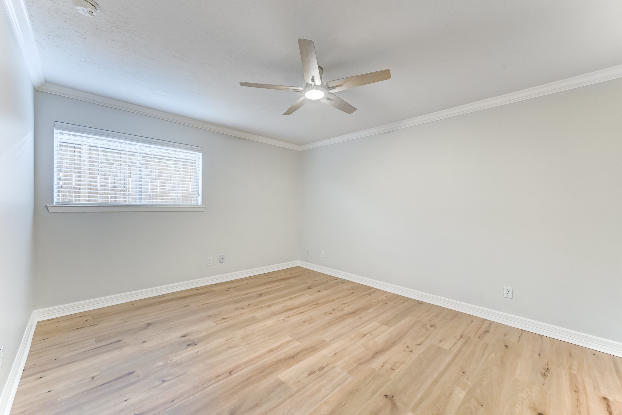 3224 Timmons Lane, Unit 157 Houston, TX 77027 - Photo 19 of 30 wooden floor in an empty room with a window