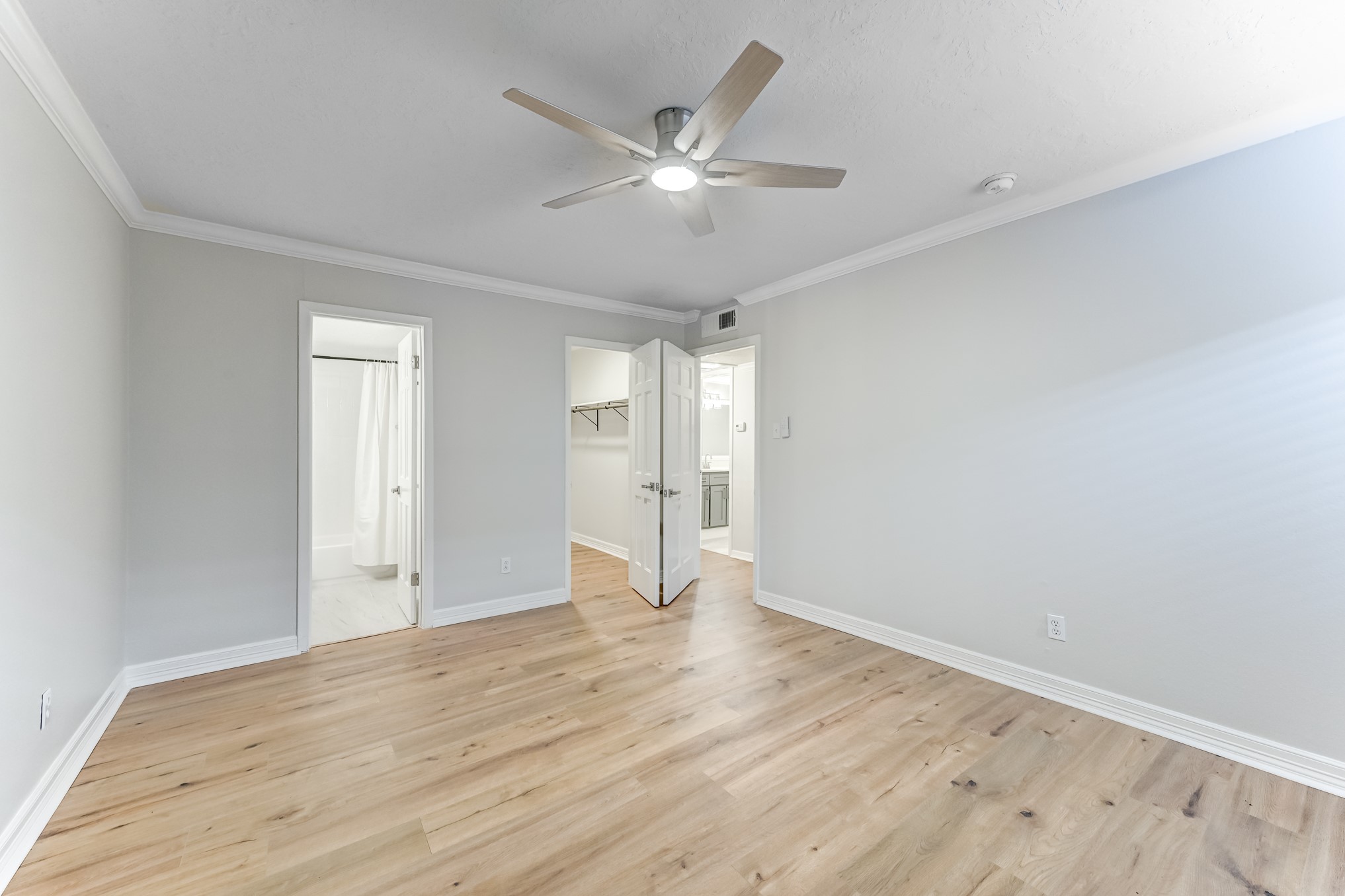 3224 Timmons Lane, Unit 157 Houston, TX 77027 - Photo 20 of 30 a view of an empty room with wooden floor