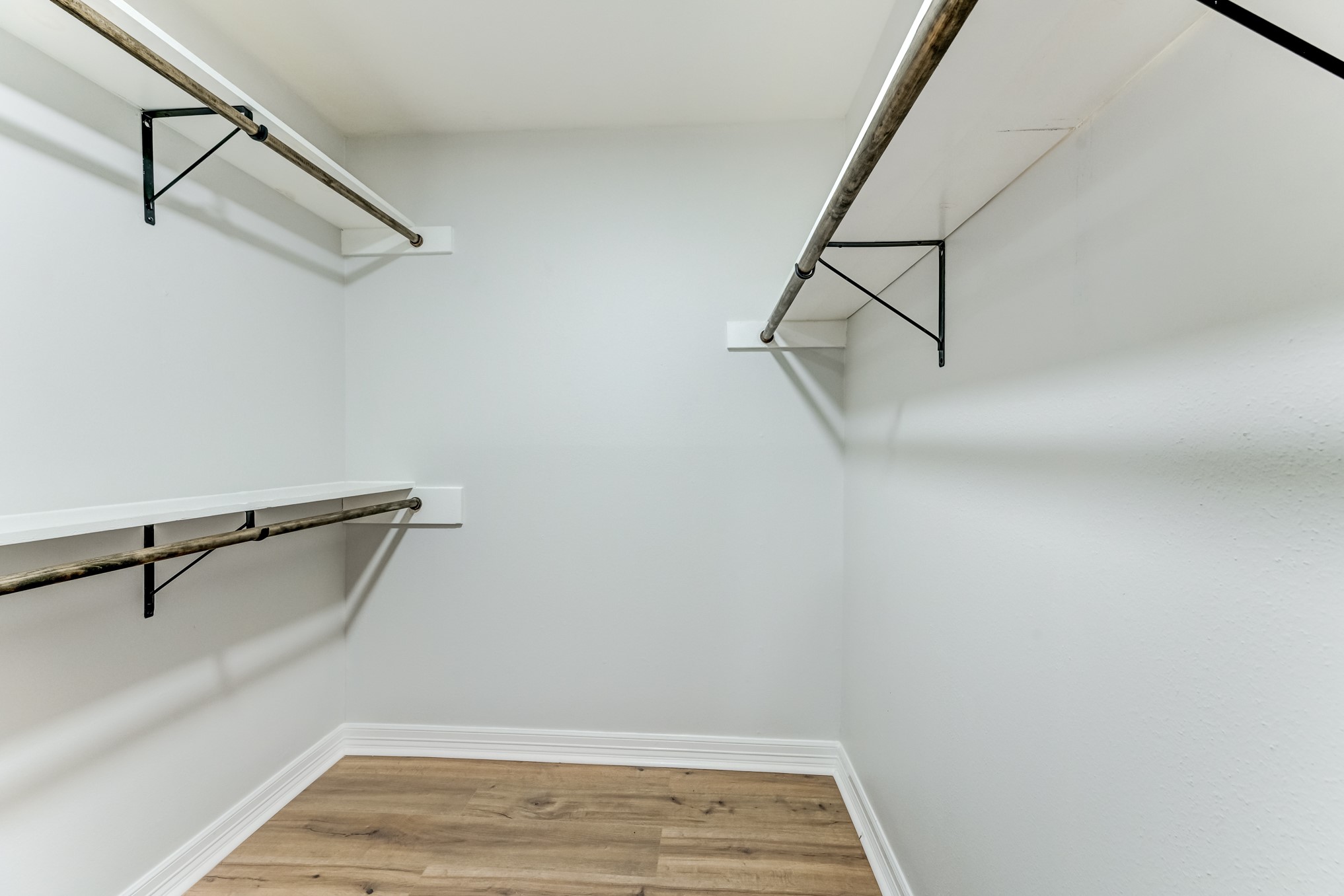 3224 Timmons Lane, Unit 157 Houston, TX 77027 - Photo 22 of 30 a view of a room with racks on the wall