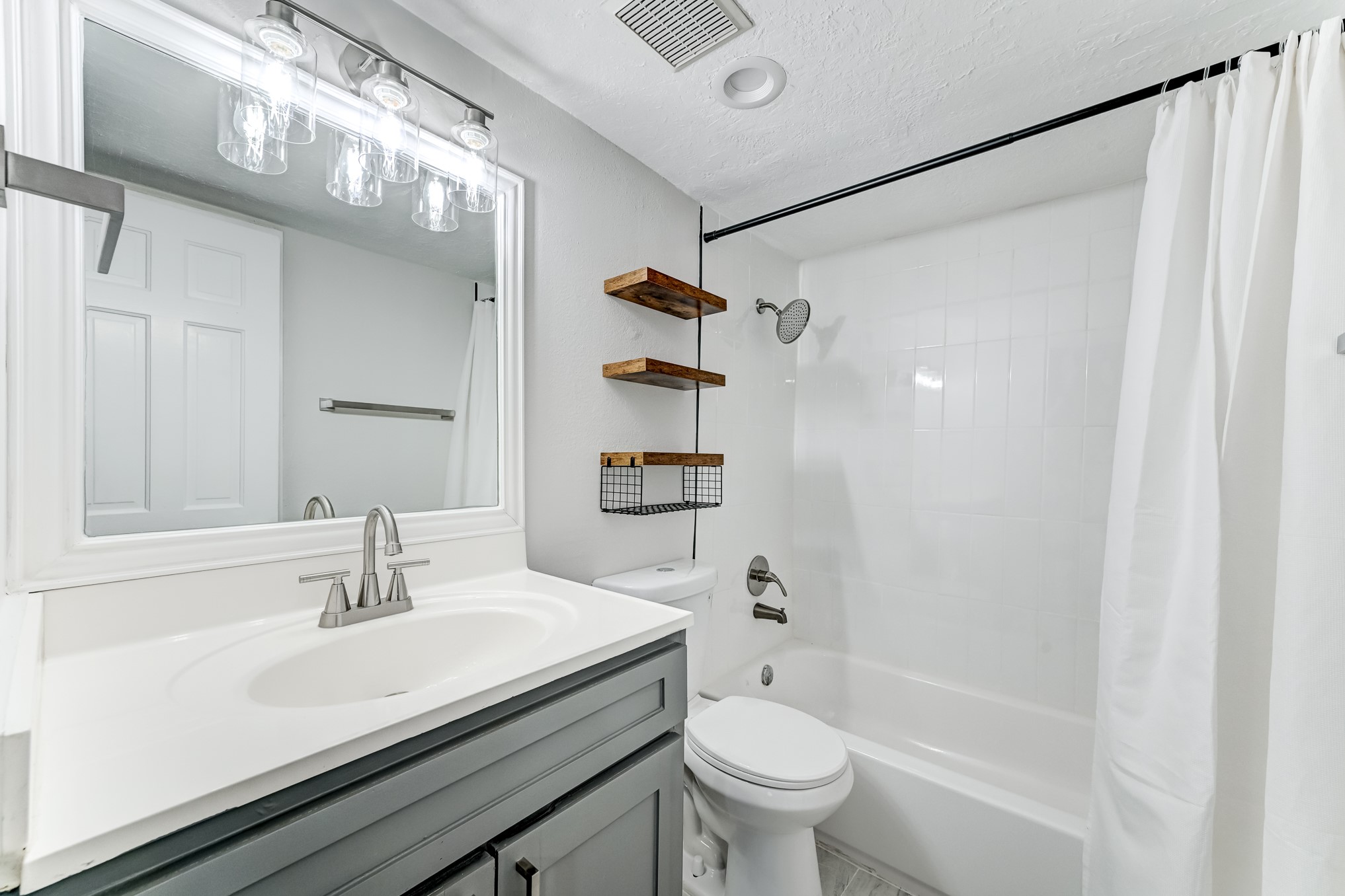 3224 Timmons Lane, Unit 157 Houston, TX 77027 - Photo 24 of 30 a bathroom with a sink a toilet and shower
