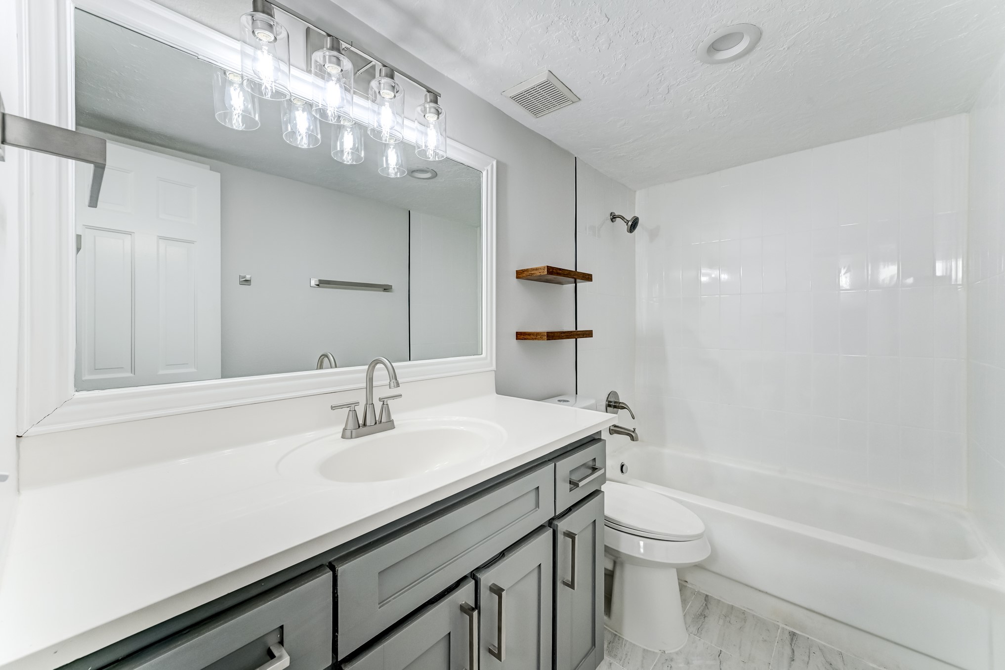 3224 Timmons Lane, Unit 157 Houston, TX 77027 - Photo 26 of 30 a bathroom with a sink a toilet and shower