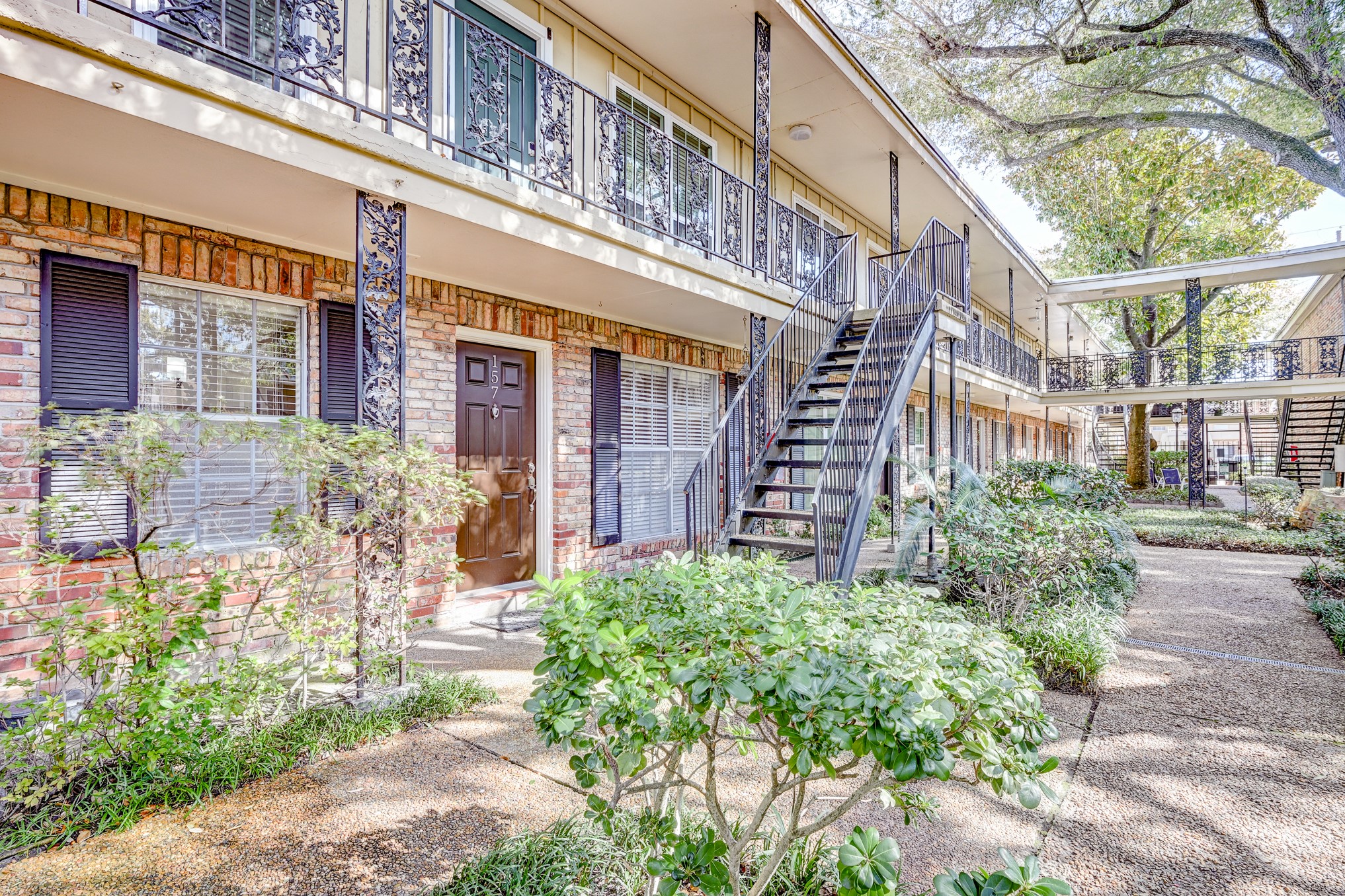 3224 Timmons Lane, Unit 157 Houston, TX 77027 - Photo 3 of 30 a view of a building with a garden