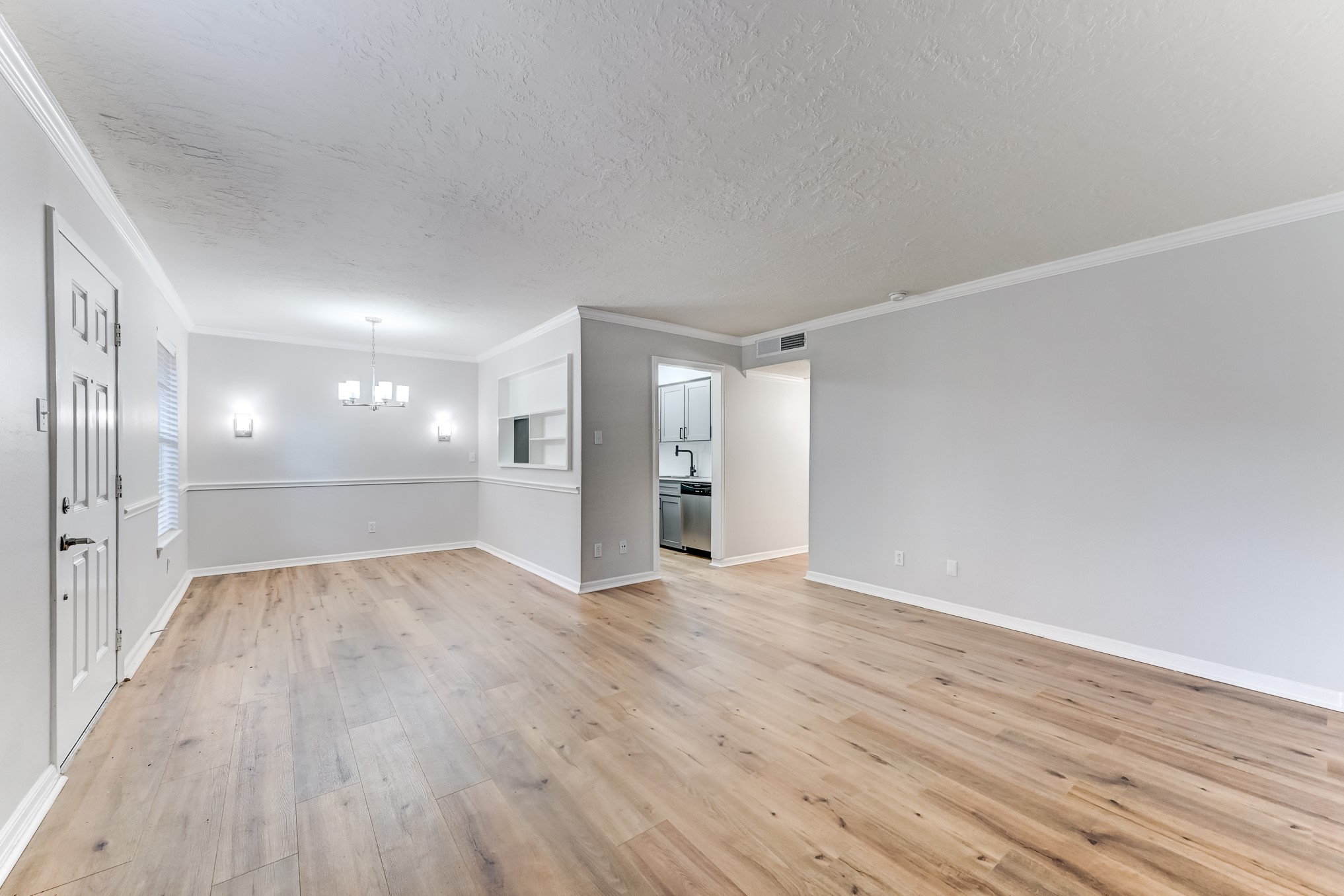 3224 Timmons Lane, Unit 157 Houston, TX 77027 - Photo 9 of 30 wooden floor in an empty room with wooden floor