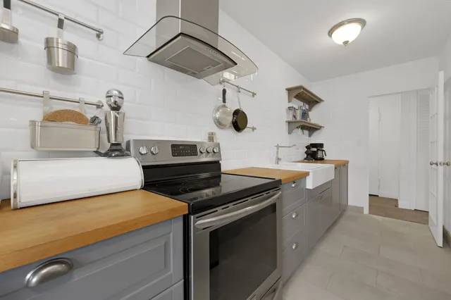 a kitchen with a stove and a sink