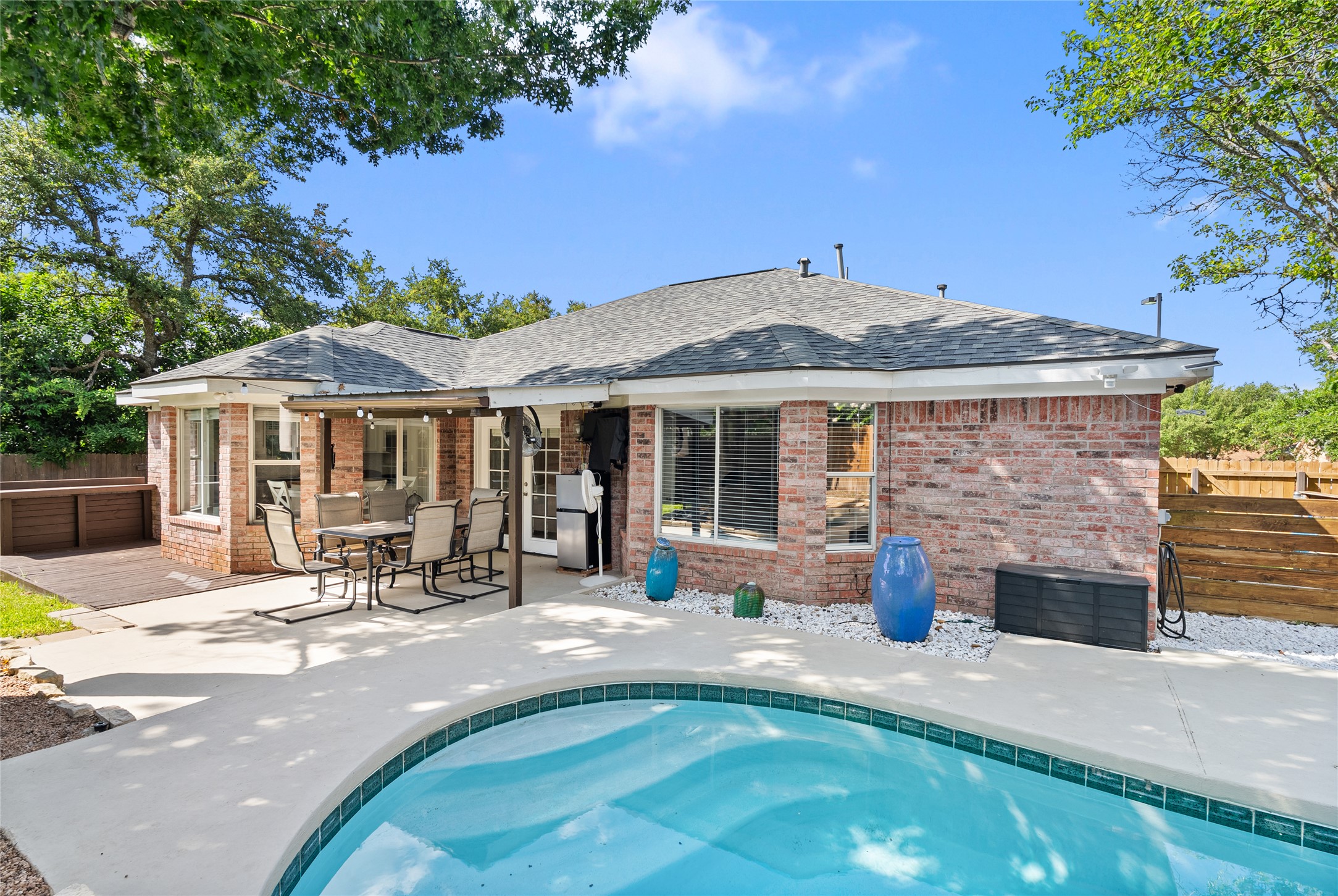 9024 Heiden Lane Austin, TX 78749 - Photo 30 of 33 The sparkling in-ground pool serves as the center of summer life, offering a refreshing escape from the Texas heat right in your own yard