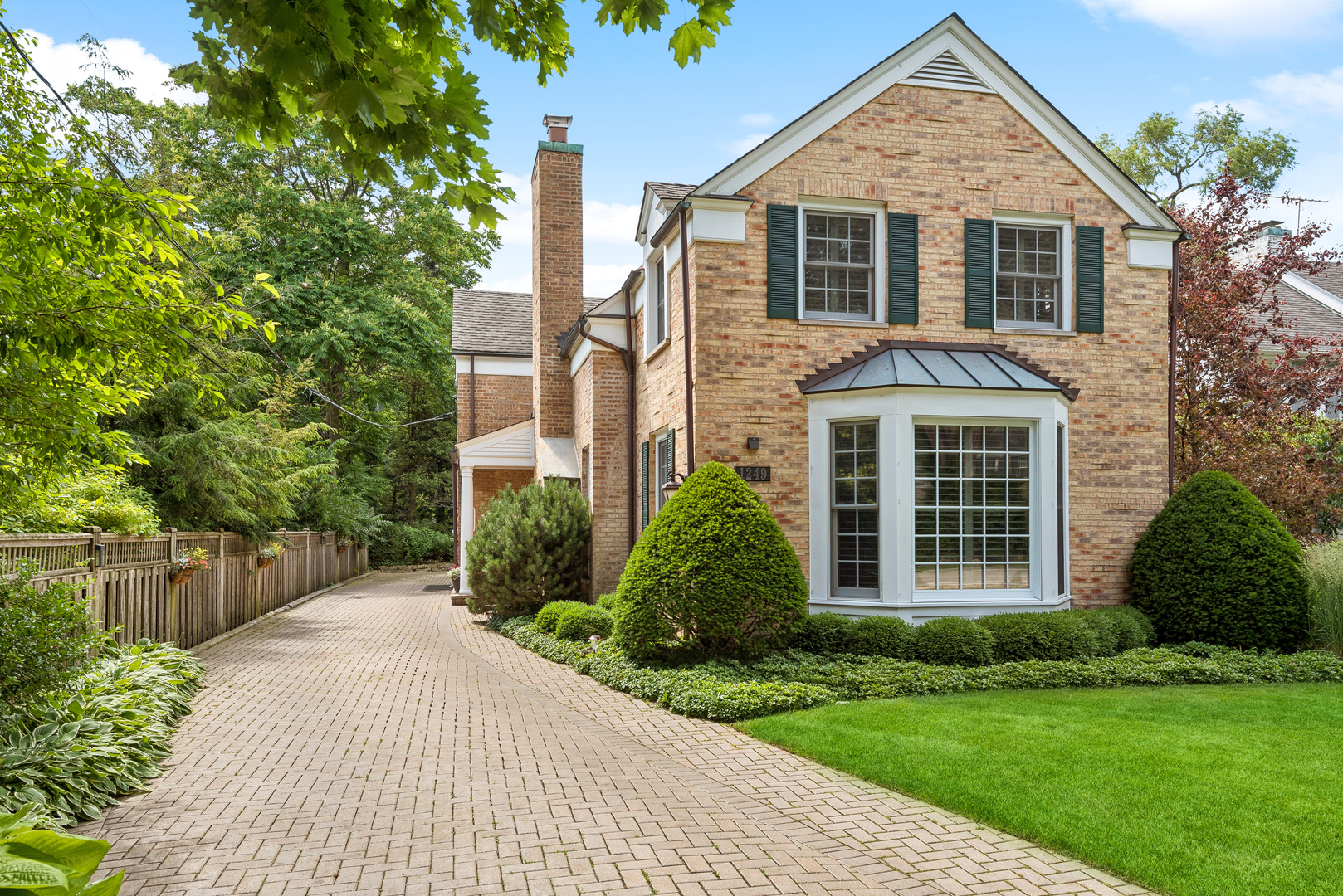 1249 Ridge Road Wilmette, IL 60091 - Photo 1 of 43 a front view of a house with a yard