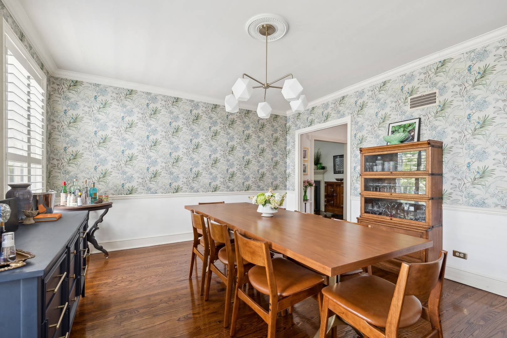 1249 Ridge Road Wilmette, IL 60091 - Photo 12 of 43 a view of a dining room with furniture and wooden floor