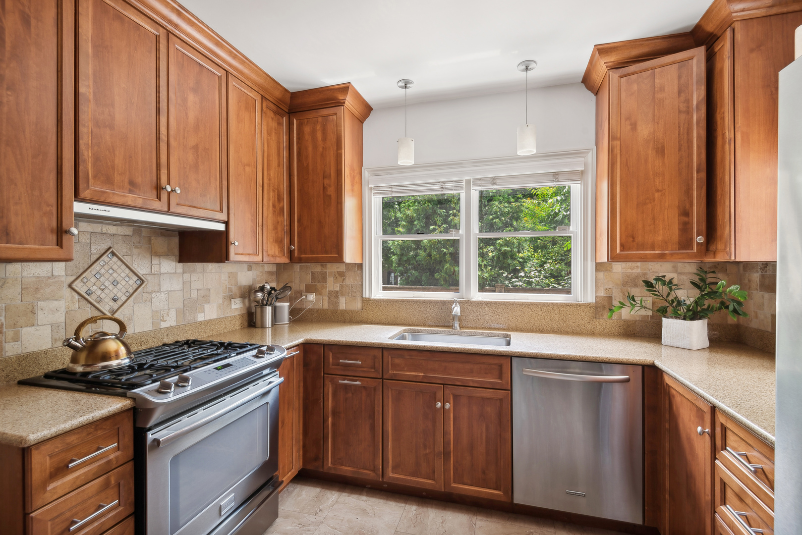 1249 Ridge Road Wilmette, IL 60091 - Photo 15 of 43 a kitchen with stainless steel appliances a sink stove and window