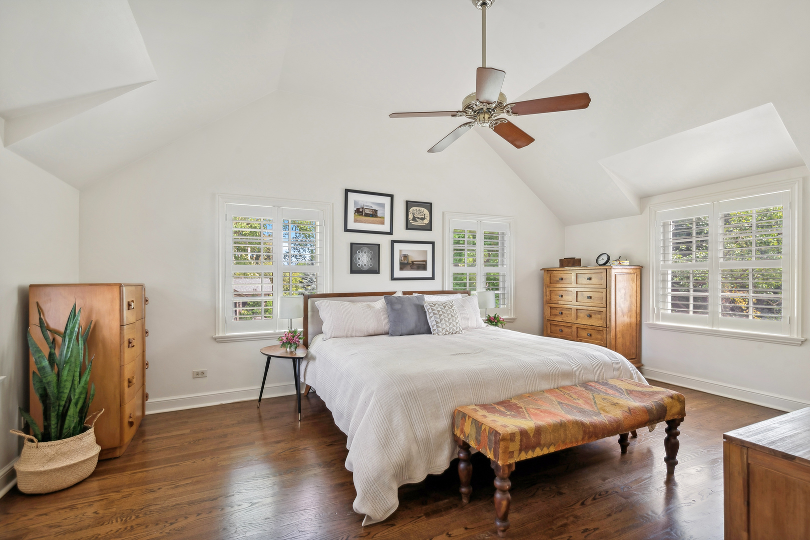 1249 Ridge Road Wilmette, IL 60091 - Photo 25 of 43 a bedroom with a large bed and a chandelier