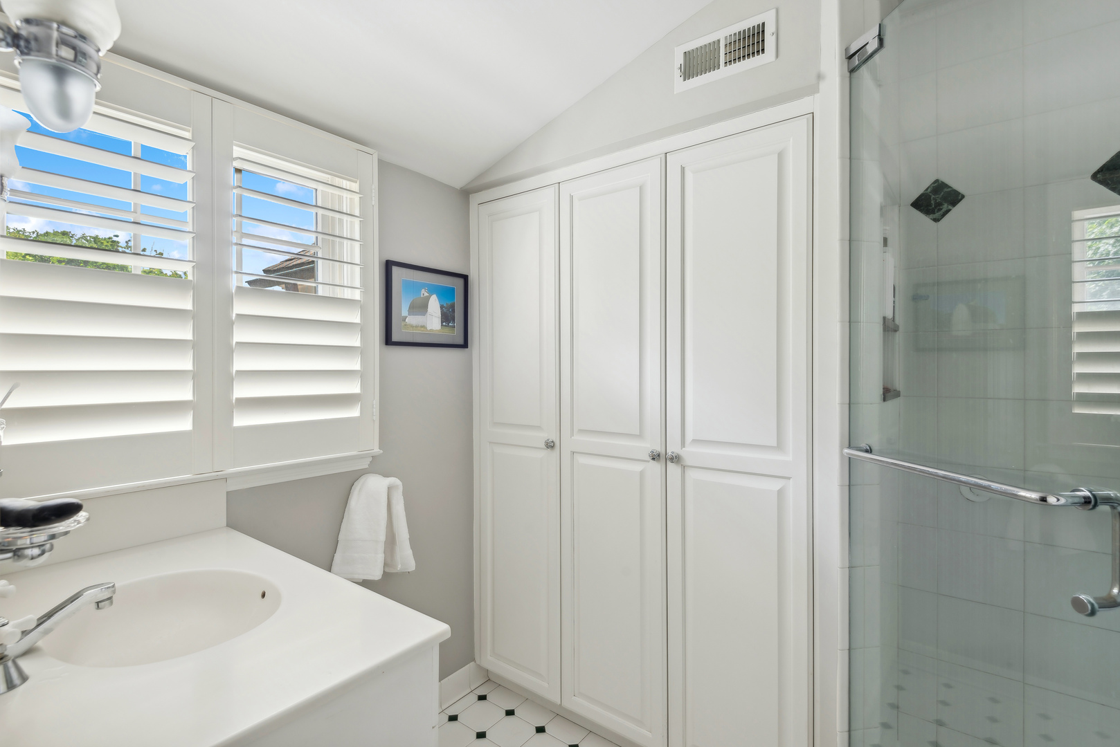 1249 Ridge Road Wilmette, IL 60091 - Photo 27 of 43 a bathroom with a sink a bathtub and a window