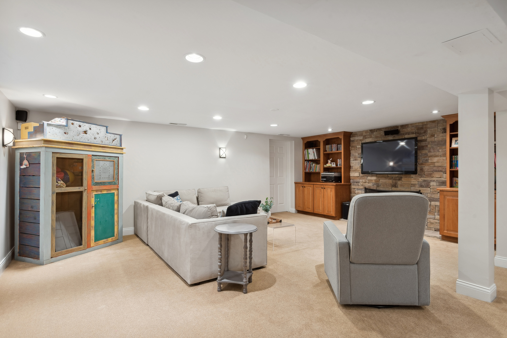 1249 Ridge Road Wilmette, IL 60091 - Photo 33 of 43 a living room with furniture and a flat screen tv