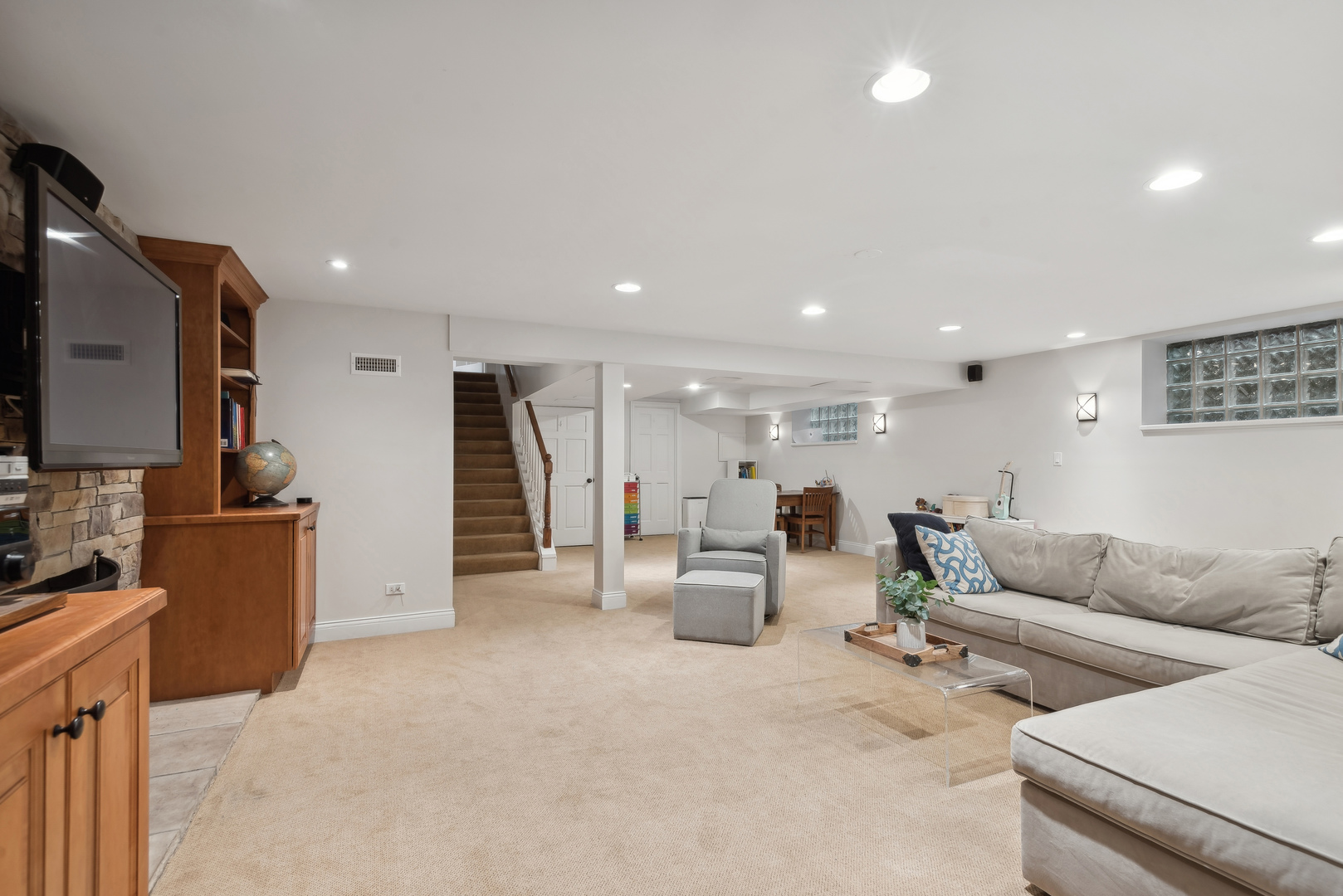 1249 Ridge Road Wilmette, IL 60091 - Photo 36 of 43 a living room with furniture and a flat screen tv