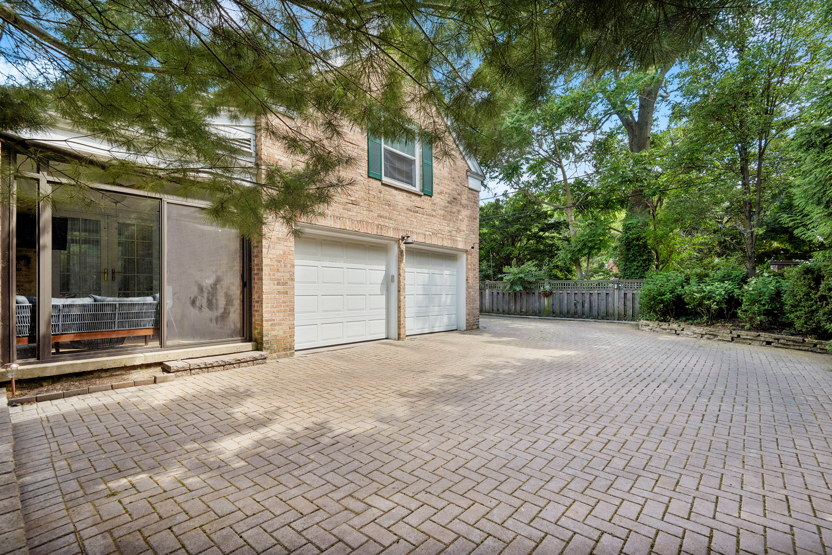 1249 Ridge Road Wilmette, IL 60091 - Photo 39 of 43 a front view of a house with a yard and garage