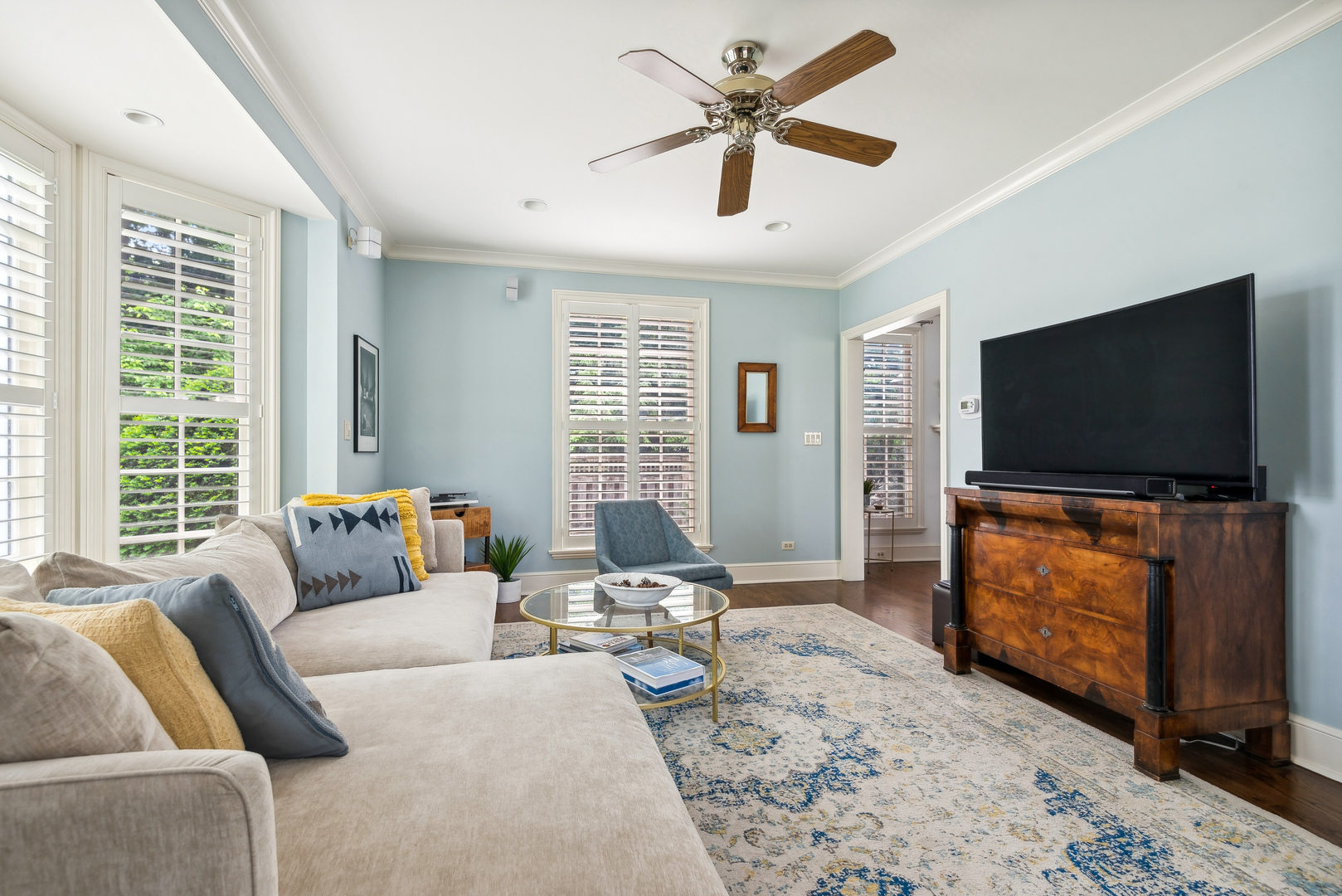 1249 Ridge Road Wilmette, IL 60091 - Photo 10 of 43 a living room with furniture and a flat screen tv