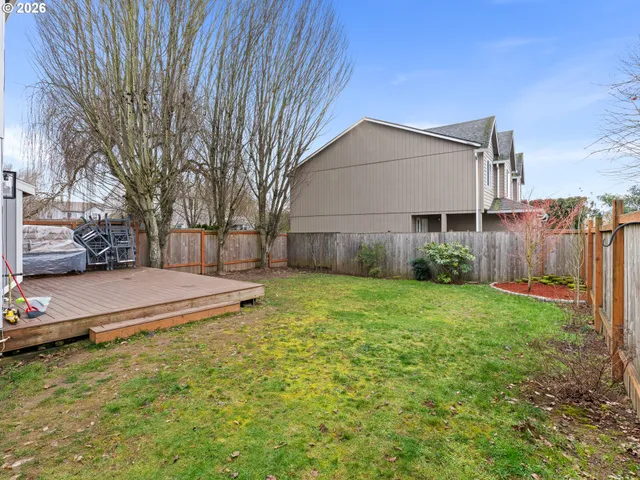 a house view with swimming pool in front of it