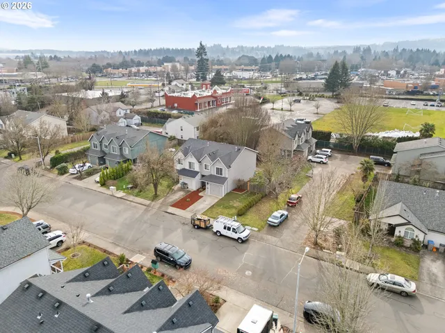 an aerial view of residential houses with outdoor space