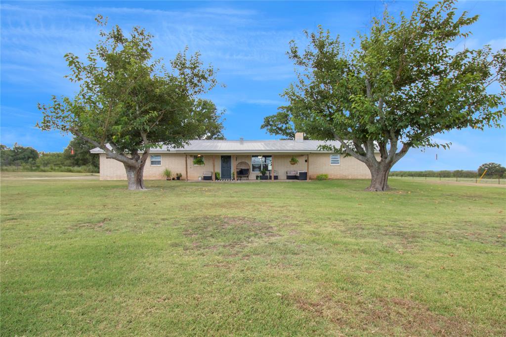 1283 Fm 218 Street West Zephyr, TX 76890 - Photo 1 of 16 a front view of a house with garden